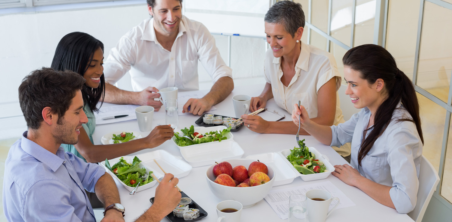 bigstock-Workers-eating-fruit-and-salad-65775559
